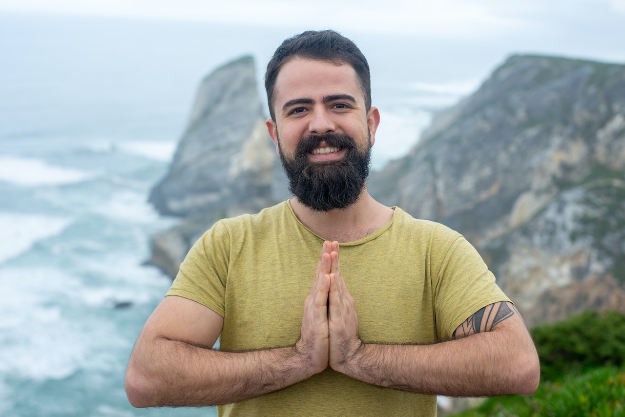 Man is doing his everyday face yoga exercies