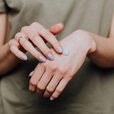 Woman is using moisturizer